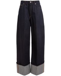Givenchy - Cuffed Raw-Denim Wide-Leg Jeans - Lyst