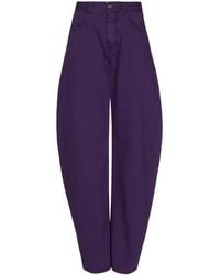 Alaïa - Round Mid-Rise Barrel-Leg Jeans - Lyst