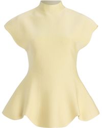 KHAITE - Andra Knit Peplum Top - Lyst