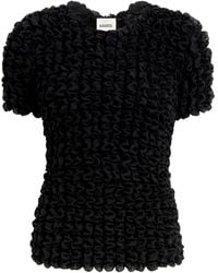 KHAITE - Polly Smocked Silk-Chiffon Top - Lyst