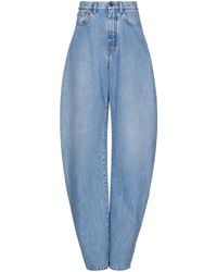 Alaïa - High-Rise Barrel-Leg Jeans - Lyst