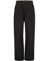 Alaïa - Low-Rise Straight-Leg Jeans - Lyst