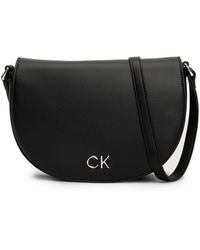 Calvin Klein - Handtasche ck daily saddle bag pebble k60k611679 ck black beh - Lyst