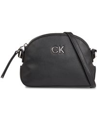 Calvin Klein - Handtasche ck daily small dome pebble k60k611761 ck black beh - Lyst