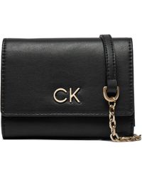Calvin Klein - Große Damen Geldbörse Re-Lock Trifold Md W/Chain K60K611458 - Lyst