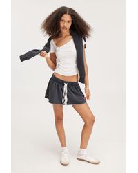 Monki - Flouncy Tie Mini Skirt - Lyst