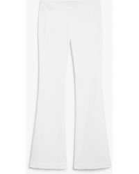 Monki - Low Waist Tight Fit Flared Stretchy Trousers - Lyst