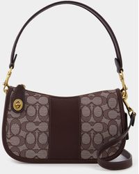 coach swinger bag in signature jacquard brown