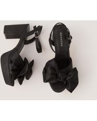 Monsoon - Grace Bow Satin Platform Heels Black - Lyst