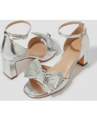 Monsoon - Taya Metallic Bow Heeled Sandals Silver - Lyst