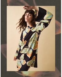 Monsoon - Clemence Women's Black & Green Butterfly Motif Aurelie Mini Tunic Dress, Size: S - Lyst