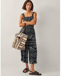Monsoon - Macie Sleeveless Shell Print Jumpsuit Black - Lyst