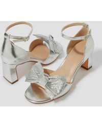 Monsoon - Taya Metallic Bow Heeled Sandals Silver - Lyst