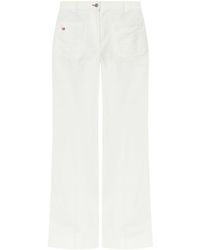 Victoria Beckham - Flared High-Waist Jeans With Subtle Logo Detail - Lyst