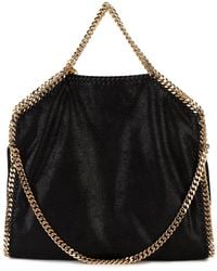 Stella McCartney - Borsa Tote Falabella Fold Over Nera e Oro - Lyst