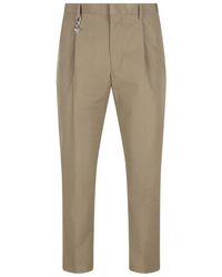 Prada - Pleated Cotton Trousers With Charm - Lyst