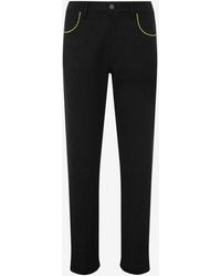 Moschino - Allover Logo Cotton And Viscose Blend Trousers - Lyst