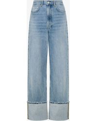 Moschino - Denim Trousers With Patches - Lyst