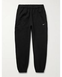 Nike - Pantaloni sportivi a gamba affusolata in jersey di misto cotone con logo ricamato Solo Swoosh - Lyst