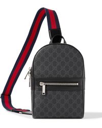 Gucci - Leather-trimmed Monogrammed Coated-canvas Sling Backpack - Lyst