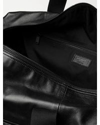 Saint Laurent Logo-embossed Leather Holdall - Black
