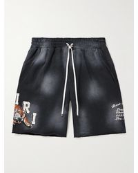 Amiri - Wide-leg Logo-print Distressed Cotton-jersey Drawstring Shorts - Lyst