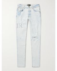 Amiri - Skinny-fit Logo-appliquéd Crystal-embellished Distressed Jeans - Lyst