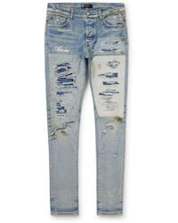 Amiri - Skinny-fit Logo-embroidered Distressed Patchwork Jeans - Lyst