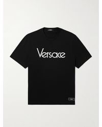 Versace - T-shirt in jersey di cotone con logo ricamato e applicazione - Lyst