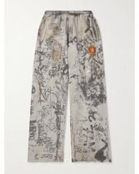 Balenciaga - Wide-leg Logo-embroidered Distressed Printed Cotton-jersey Sweatpants - Lyst