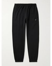 Nike - Solo Swoosh schmal zulaufende Jogginghose aus Jersey aus einer Baumwollmischung mit Logostickerei - Lyst