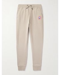 Canada Goose - Huron Tapered Logo-Appliquéd Cotton-Jersey Sweatpants - Lyst