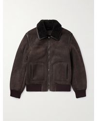 Tod's - Bomber in shearling con finiture in pelle - Lyst