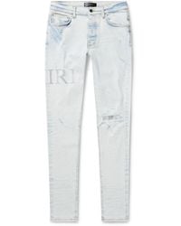 Amiri - Skinny-fit Logo-appliquéd Crystal-embellished Distressed Jeans - Lyst
