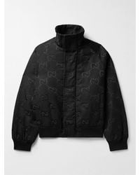 Gucci - Wattierte Jacke aus Canvas aus einer Baumwollmischung mit Jacquard-Logomuster - Lyst