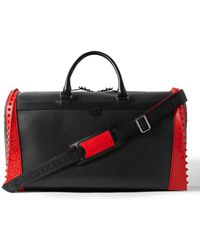 Mens Bags Duffel bags and weekend bags Christian Louboutin Sneakender Studded Rubber-trimmed Full-grain Leather Weekend Bag in Black for Men 