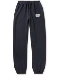 Liberal Youth Ministry Logo-print Tapered Cotton-jersey Sweatpants - Blue