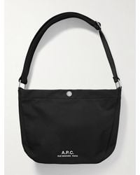 A.P.C. - Journal Small Logo-Print Recycled-Nylon Messenger Bag - Lyst