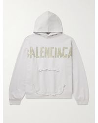 Balenciaga - Oversized Distressed Logo-print Cotton-jersey Hoodie - Lyst