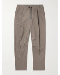 John Elliott - Studio Tapered Pleated Cotton Drawstring Trousers - Lyst