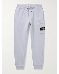 Stone Island - Tapered Logo-Appliquéd Garment-Dyed Cotton-Jersey Sweatpants - Lyst