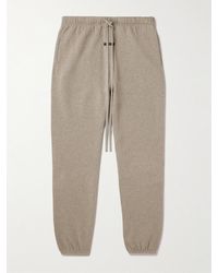 Fear Of God - Schmal zulaufende Jogginghose aus Jersey aus einer Baumwollmischung mit Logoapplikation - Lyst