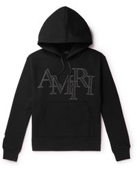 Amiri - Logo-appliquéd Cotton-jersey Hoodie - Lyst