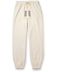 Alanui - Akasha Tapered Embroidered Cotton-jersey Sweatpants - Lyst
