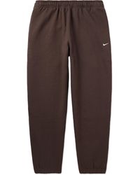 Nike - Solo Swoosh Tapered Logo-embroidered Cotton-blend Jersey Sweatpants - Lyst