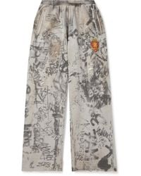 Balenciaga - Wide-leg Logo-embroidered Distressed Printed Cotton-jersey Sweatpants - Lyst