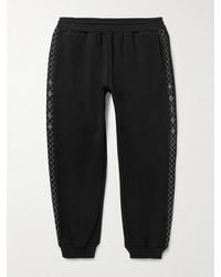 Adish - Tapered Logo-embroidered Cotton-jersey Sweatpants - Lyst