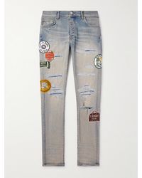 Amiri - Schmal geschnittene Jeans mit Applikationen in Distressed-Optik - Lyst