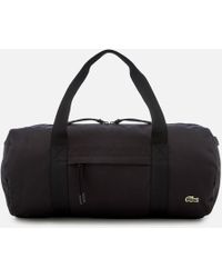 Lacoste Holdalls and weekend bags for Men - Lyst.com