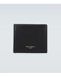 Dolce & Gabbana Portafoglio bifold in vitello con logo a fuoco - Nero